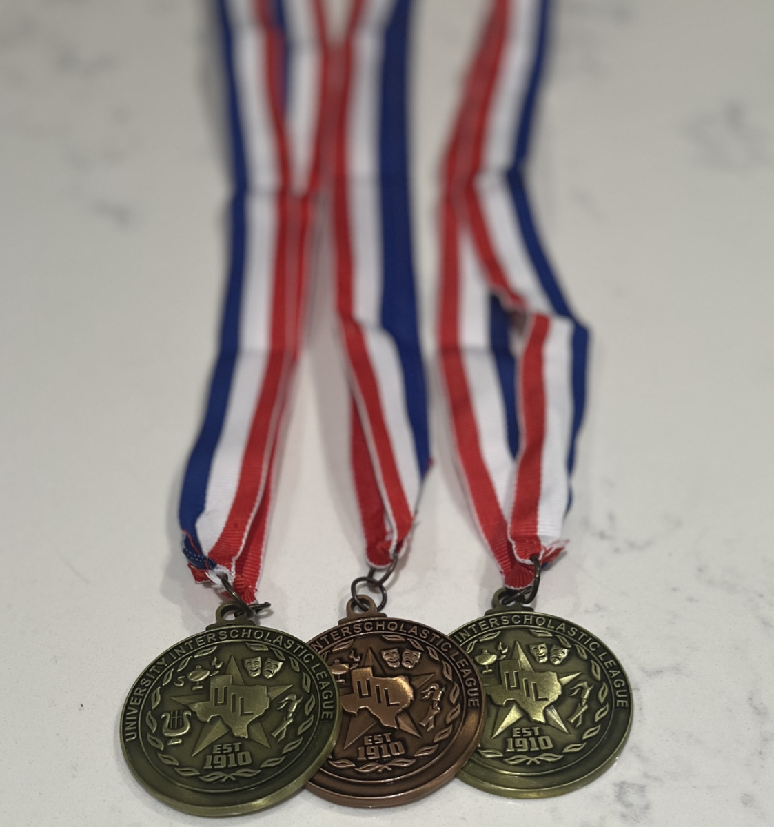 Medals from UIL competition. 